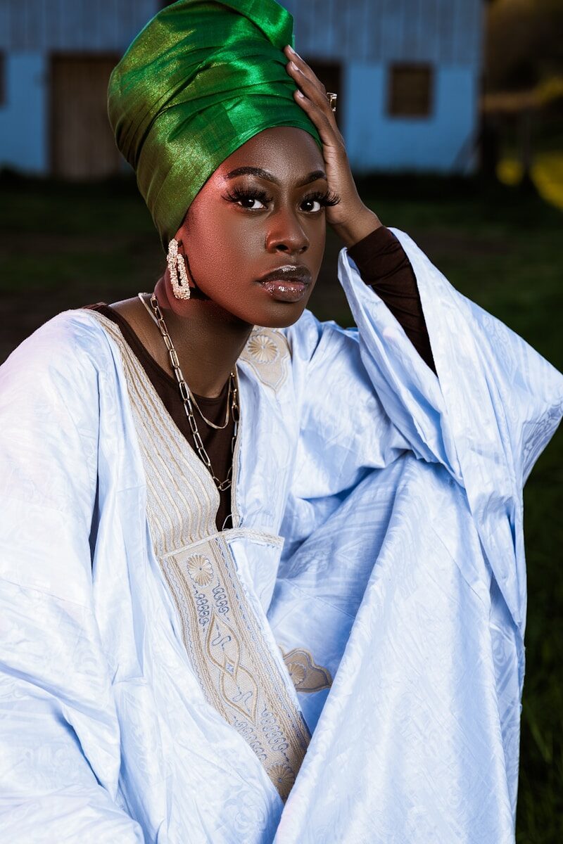 a woman with a green turban on her head
