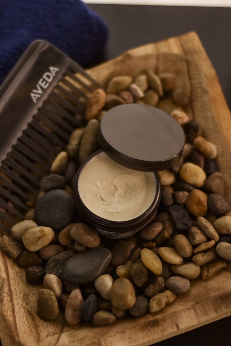 A comb and some rocks on a table